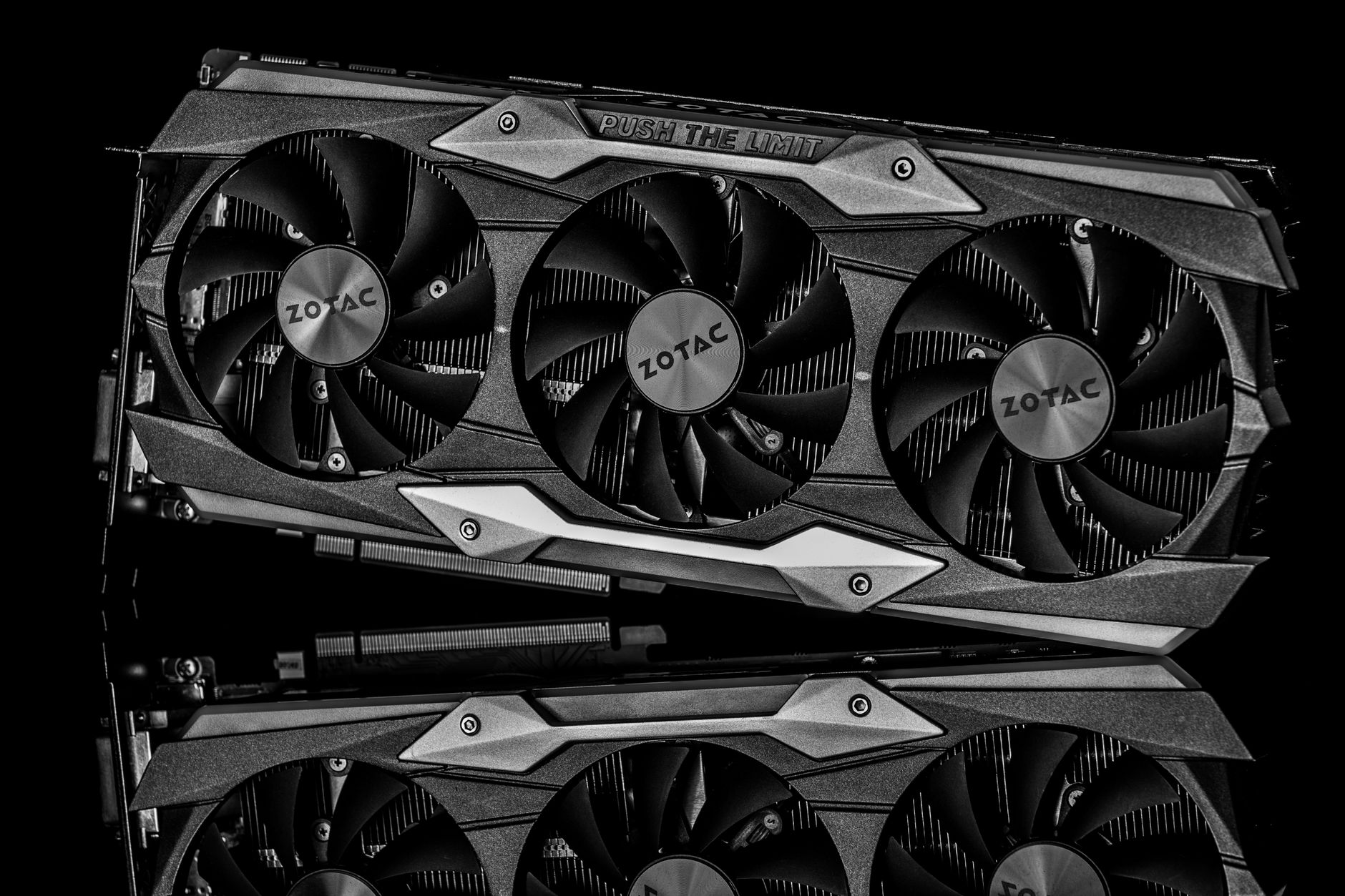 Black and white image of a graphics card with technology theme and metal reflection.