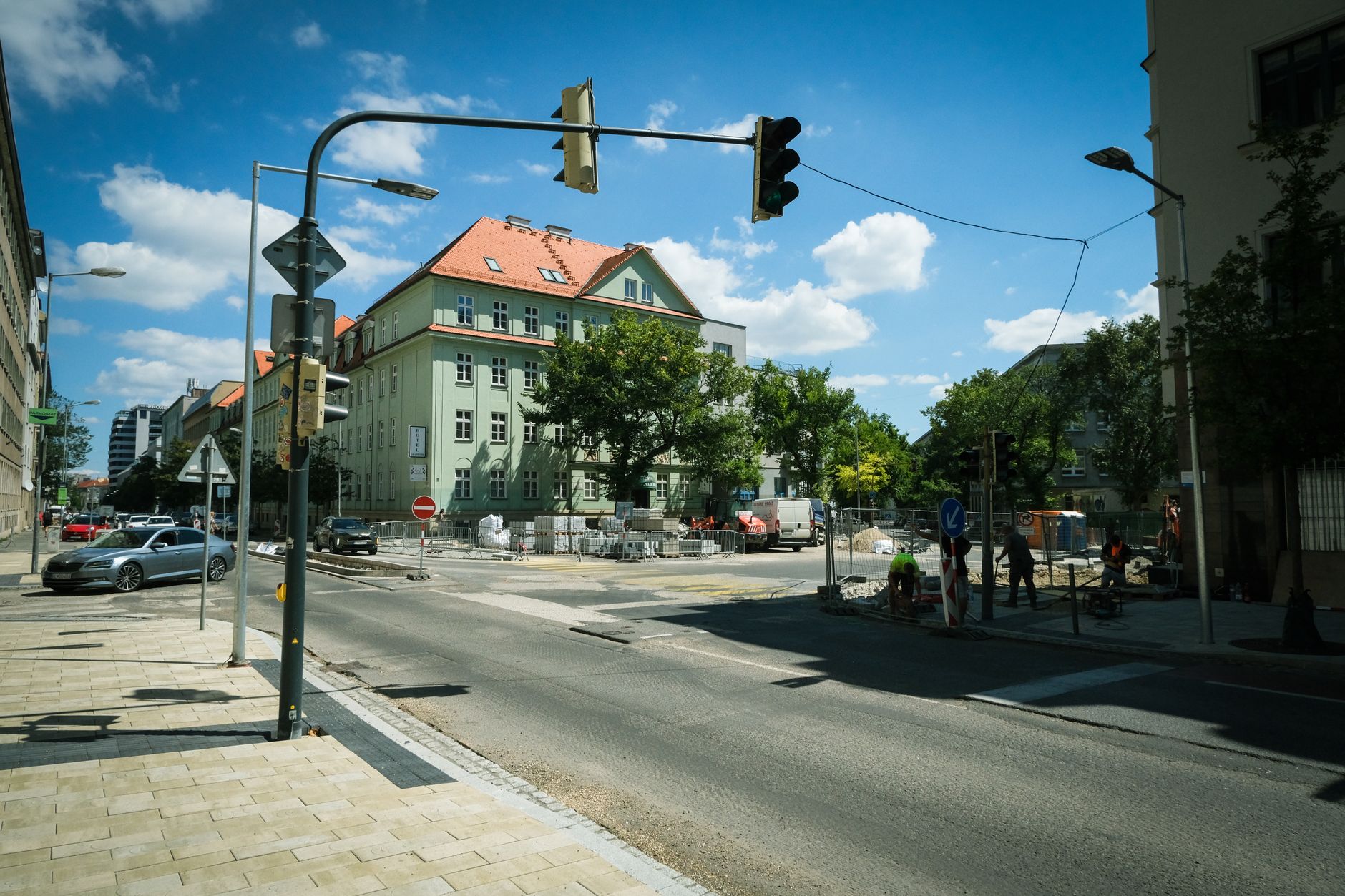 Street construction site in Bratislava, Slovakia featuring historical buildings and traffic.