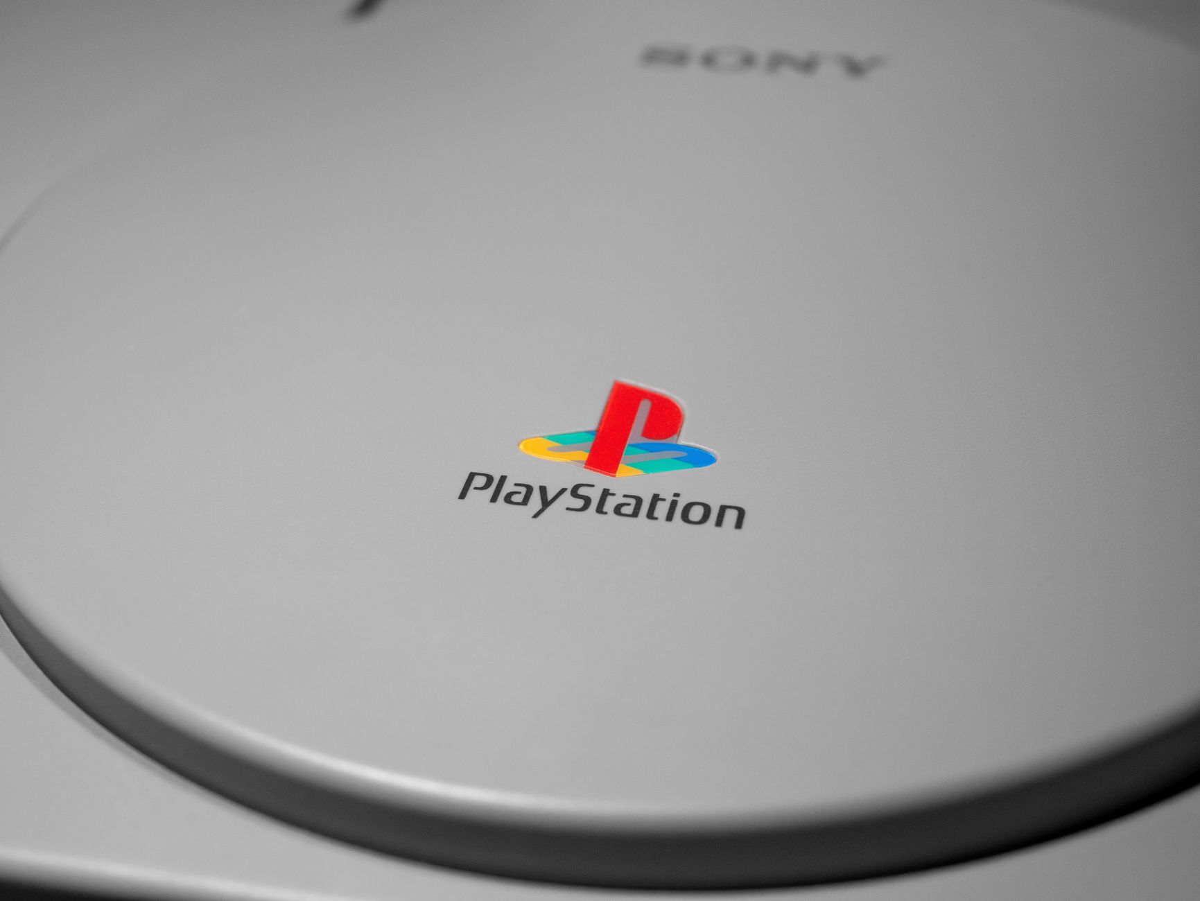 Detailed close-up of iconic PlayStation console logo, perfect for gaming-related content.