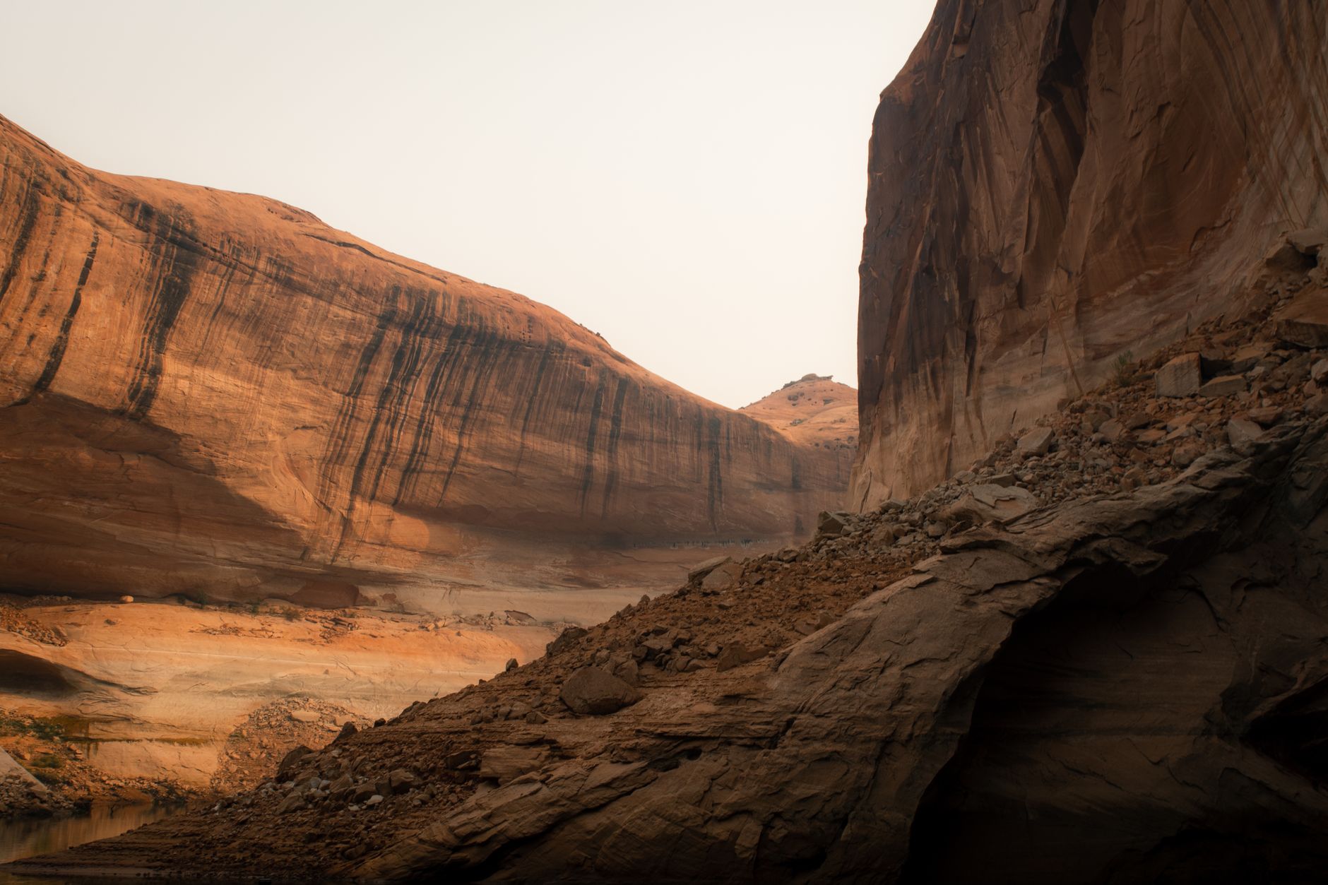 Explore stunning sandstone cliffs and rugged terrain in this breathtaking desert canyon landscape.