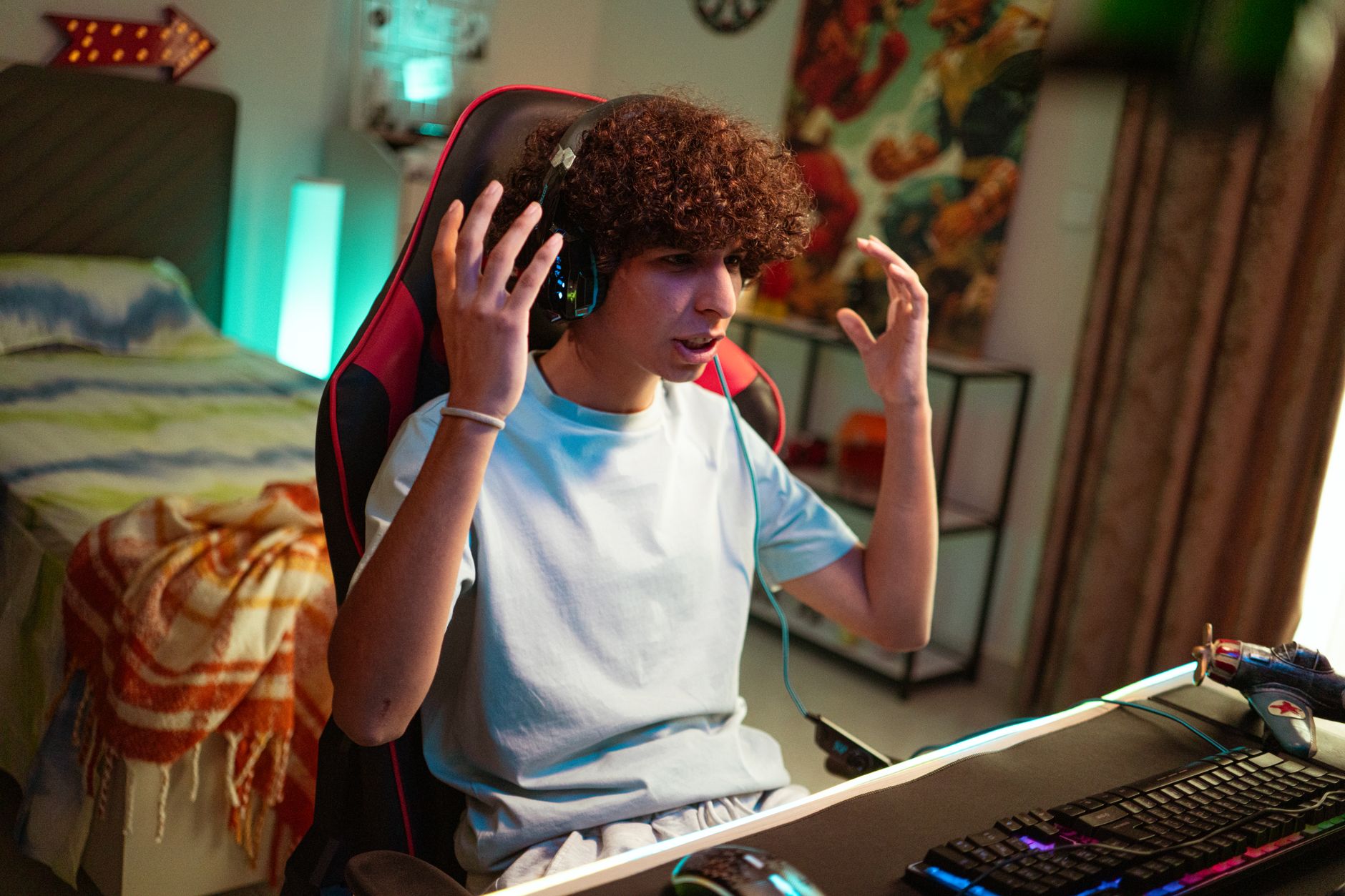 Focused teenager enjoying an online gaming session at home.